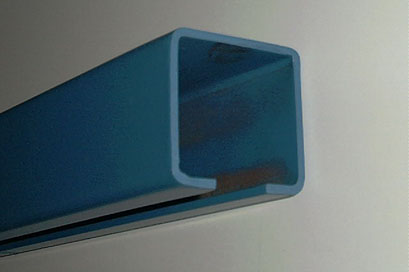 Blue painted enclosed track for overhead conveyor